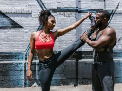 Leg stretching against a wall for support